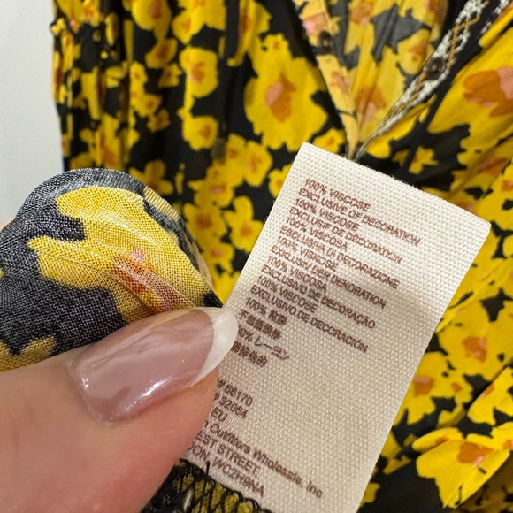 Free People Love Letter Floral Tunic Blouse in a black and yellow floral print. - Picture 9 of 11